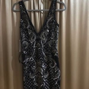 Black beaded cocktail dress , by Bebe